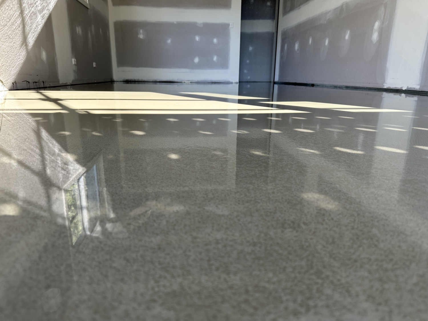 Reflective finished floor levelling surface in a Sydney room